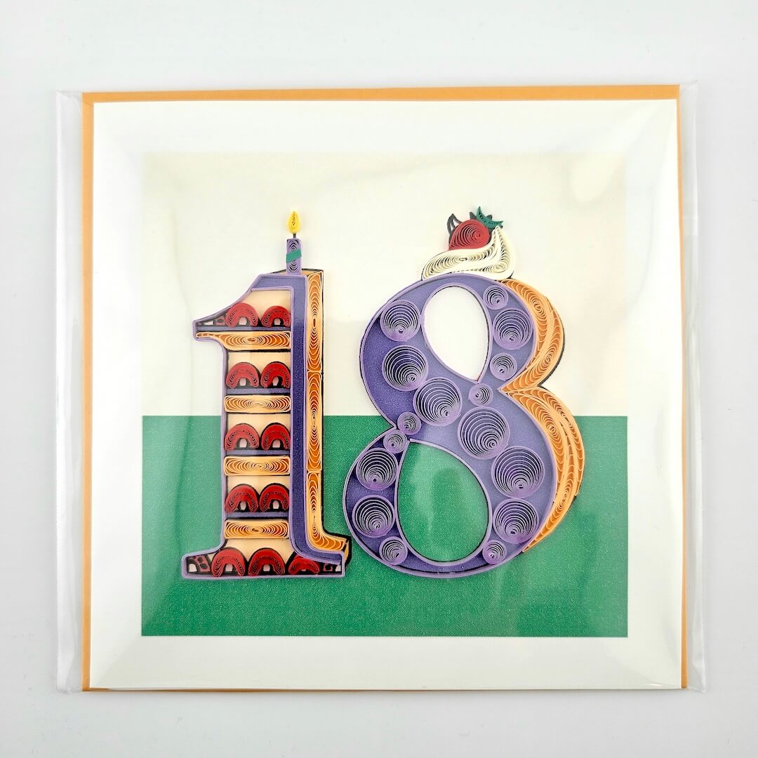Framed artwork with a colorful number '18' design on a white background