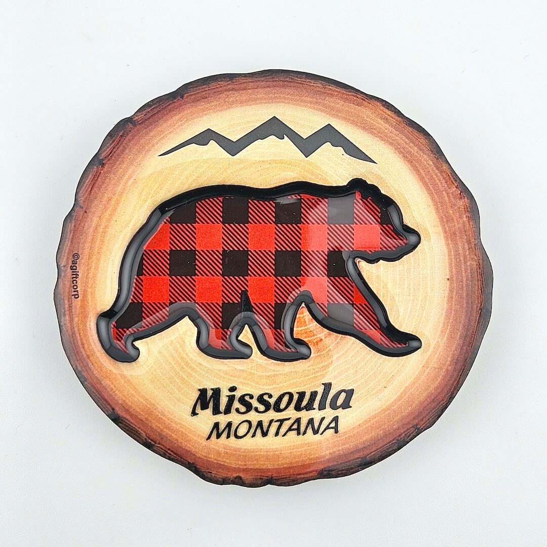 Wooden cutout with a bear silhouette in red plaid and 'Missoula Montana' text on a white background