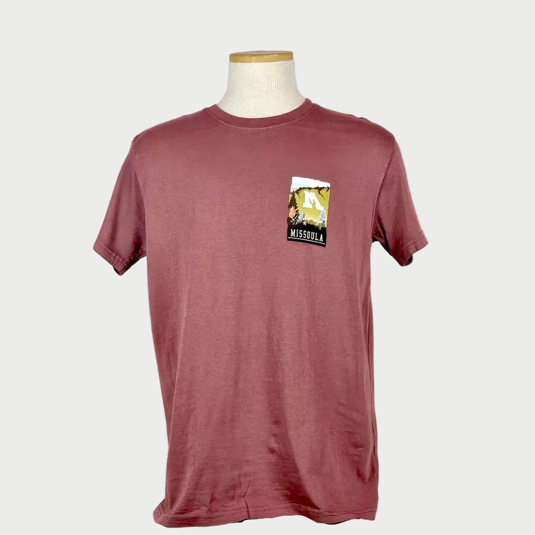 Maroon t-shirt with a graphic on a mannequin against a white background