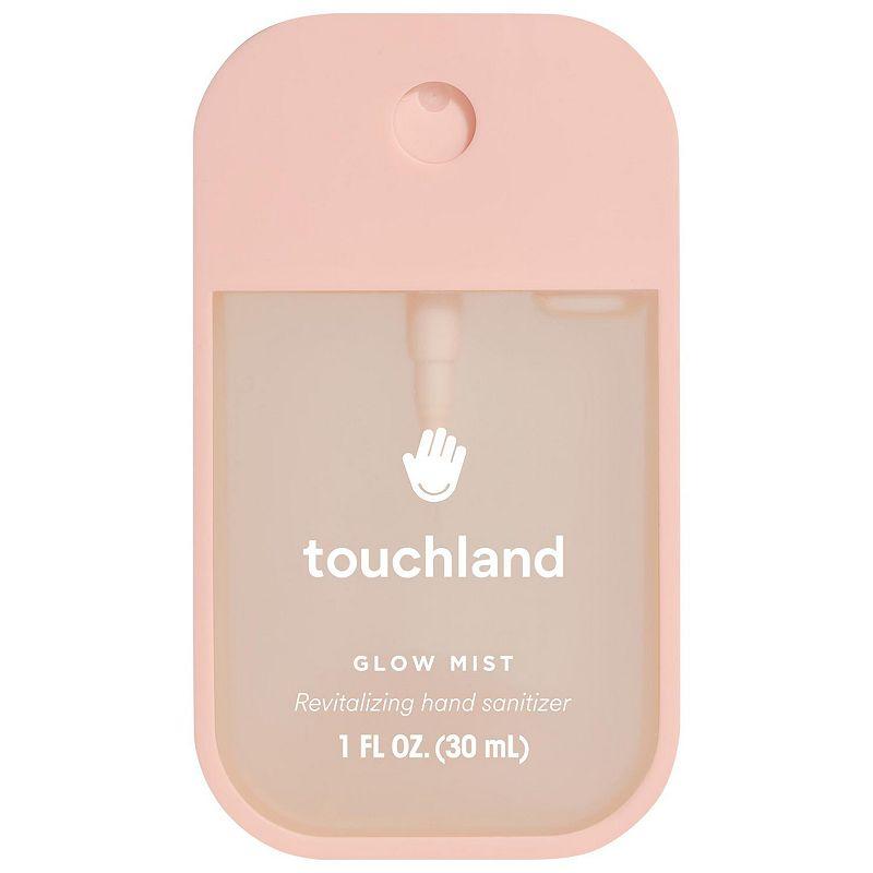 Pink spray hand sanitizer against white background.