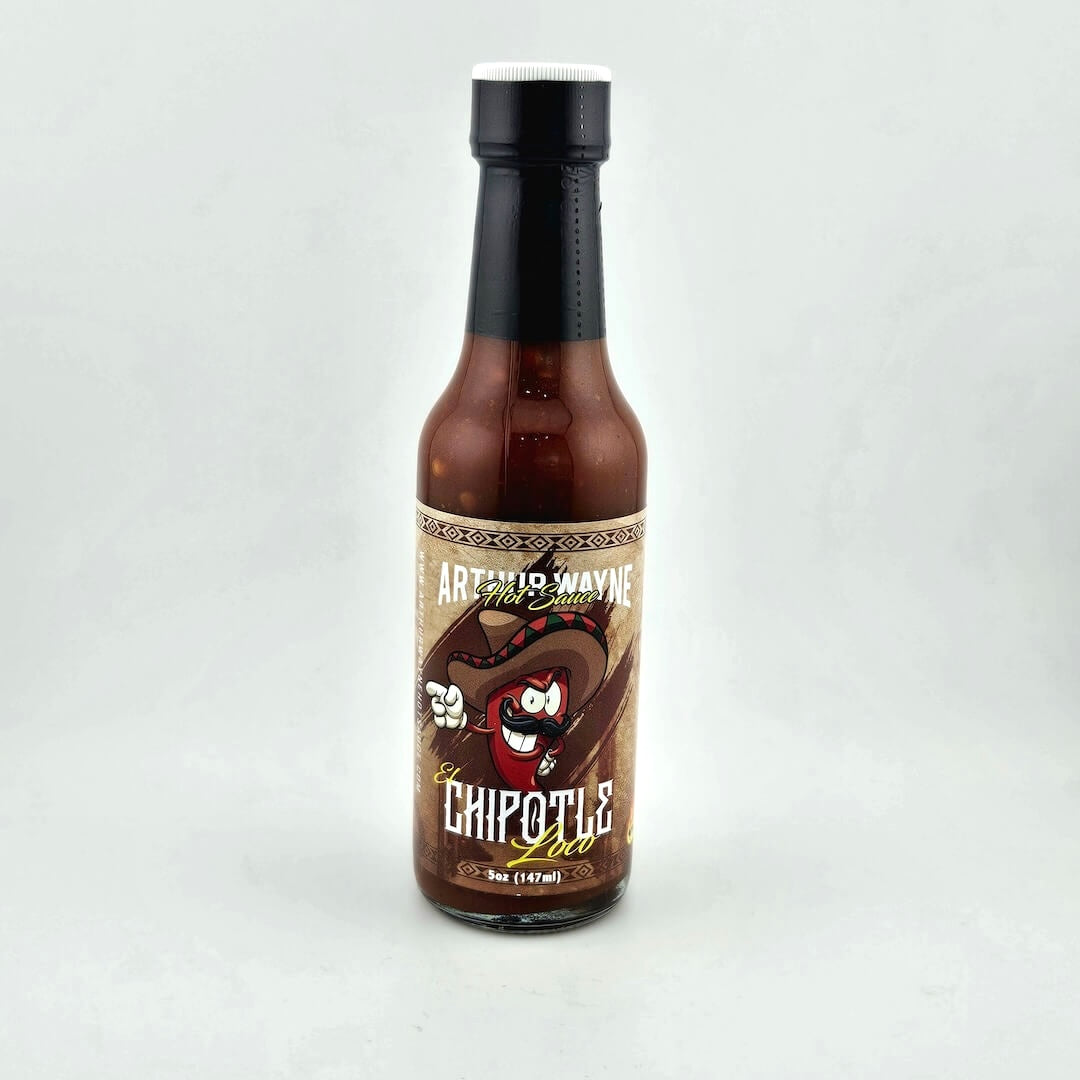 Glass bottle of hot sauce safety sealed with plastic. Label across main body of bottle details flavor and image depicting it.
