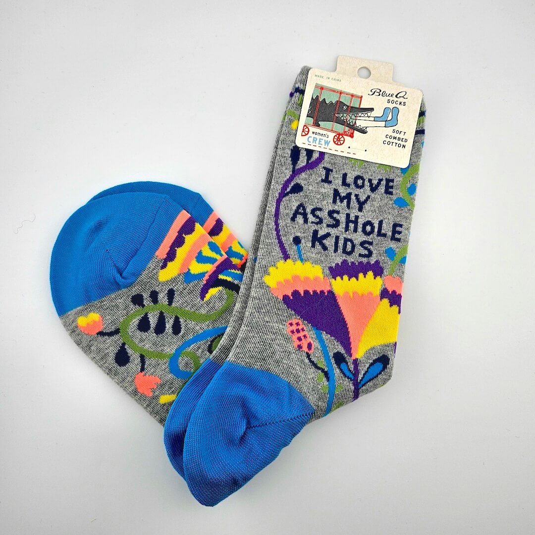 Colorful socks with text and patterns on a white background