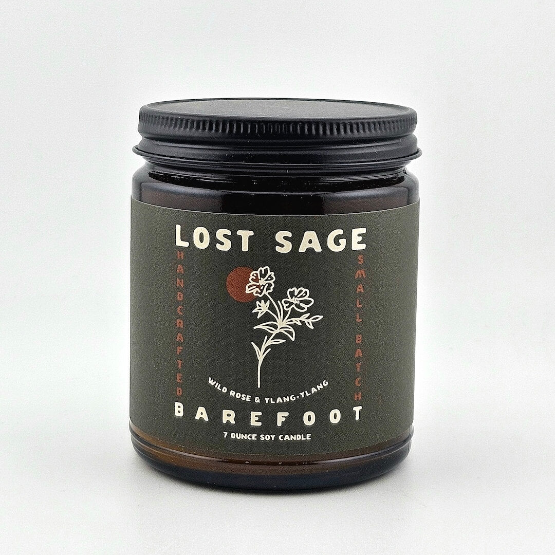 Candle jar labeled 'Lost Sage, Barefoot' on a white background