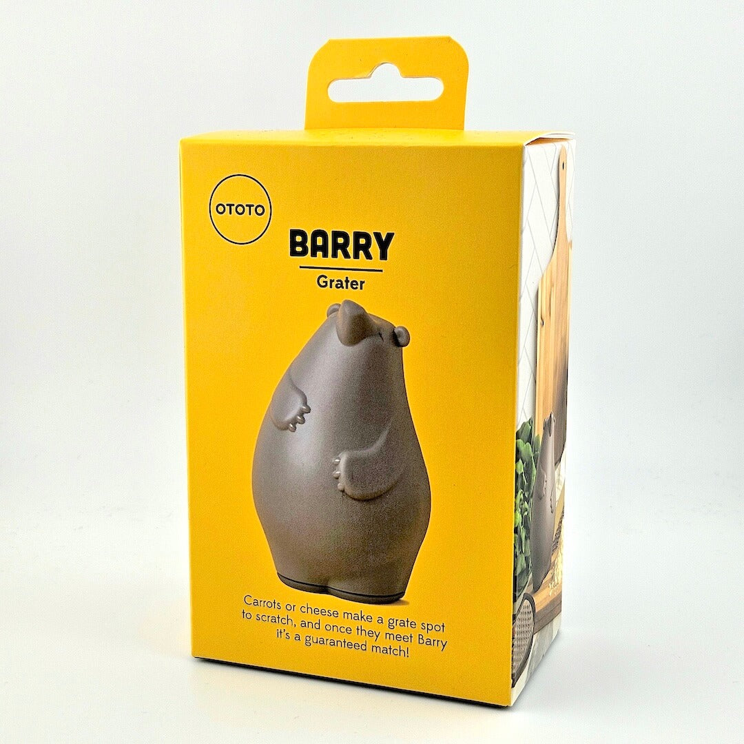 Yellow box for bear-shaped grater against white background.