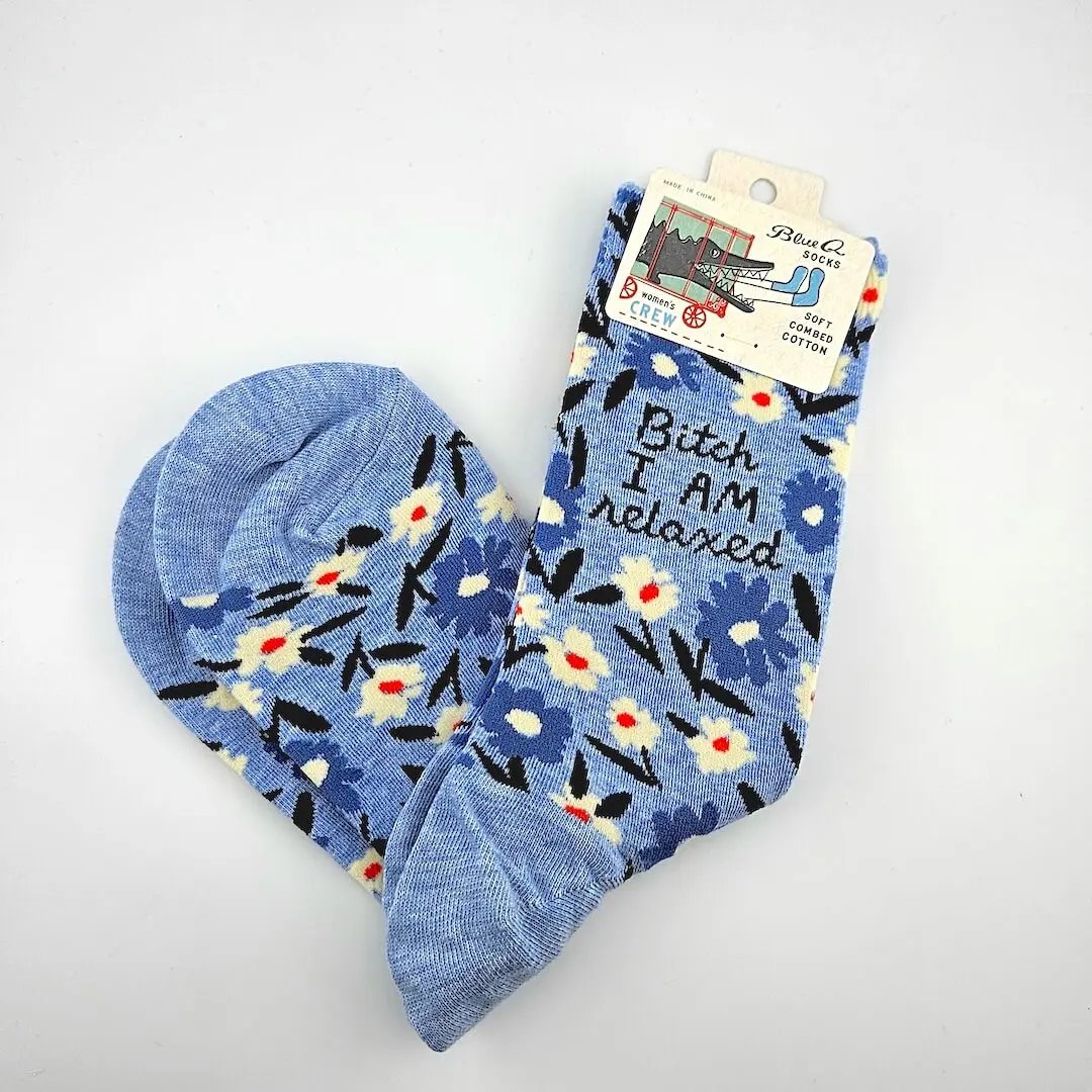 Blue floral socks with text on a white background