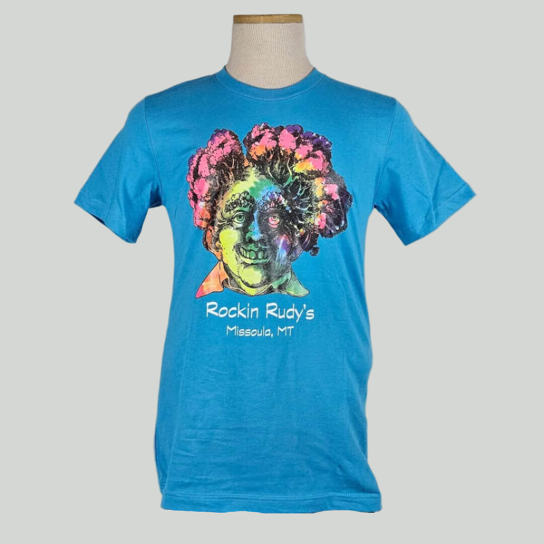 Marine blue shirt with tie dye colored bust of man with broccoli/trees for hair in sketch style above store name & location.