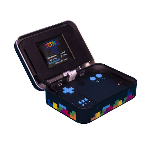 Open tin with Tetris game inside against white background.