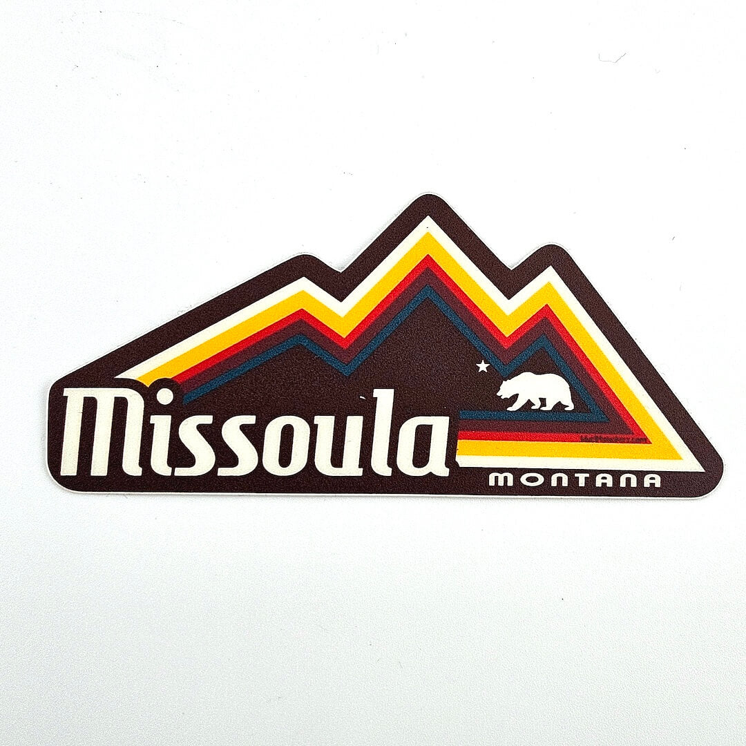 Sticker with 'Missoula Montana' text and mountain design on a white background