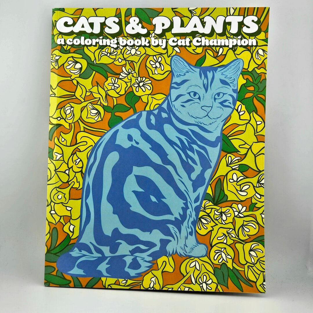 Coloring book cover with a blue cat and floral design, titled 'Cats & Plants'.