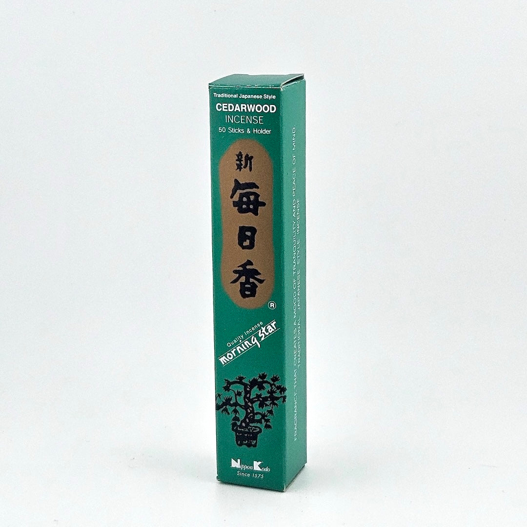 teal box of 50 incense sticks with Japanese writing above bonsai tree packaging on gray background.
