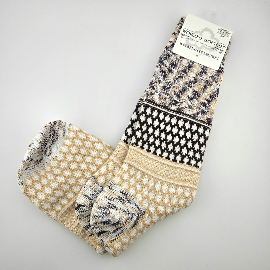 Pair of patterned socks on a gray background with a 'World's Softest' label.