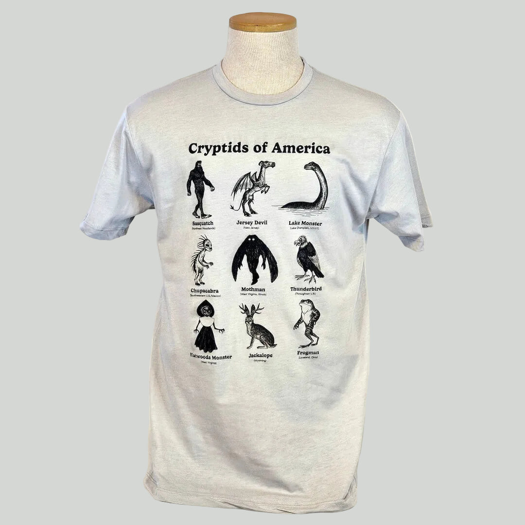 T-shirt with illustrations of cryptids of America on a mannequin against a white background
