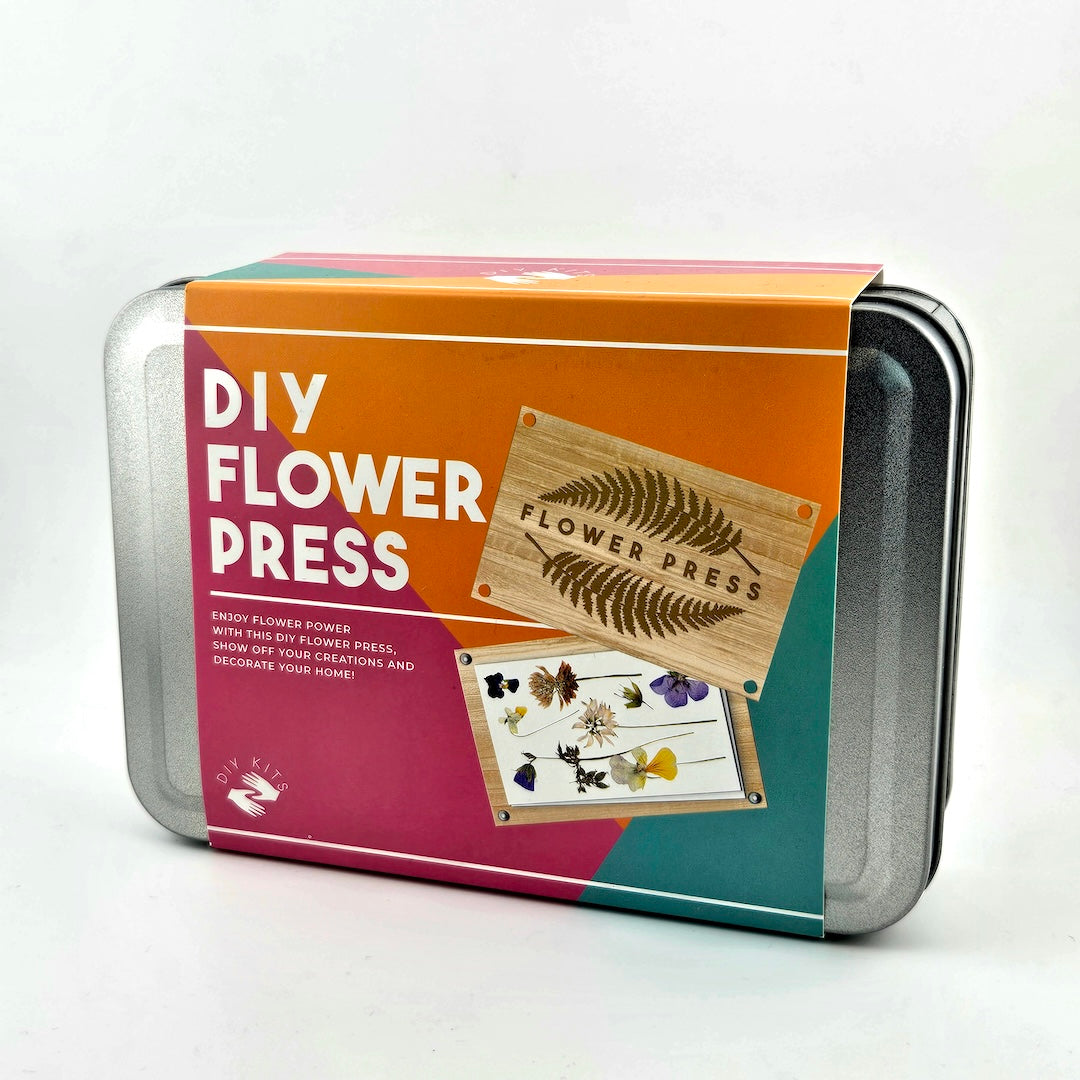 DIY flower press kit packaging with images of pressed flowers on a white background
