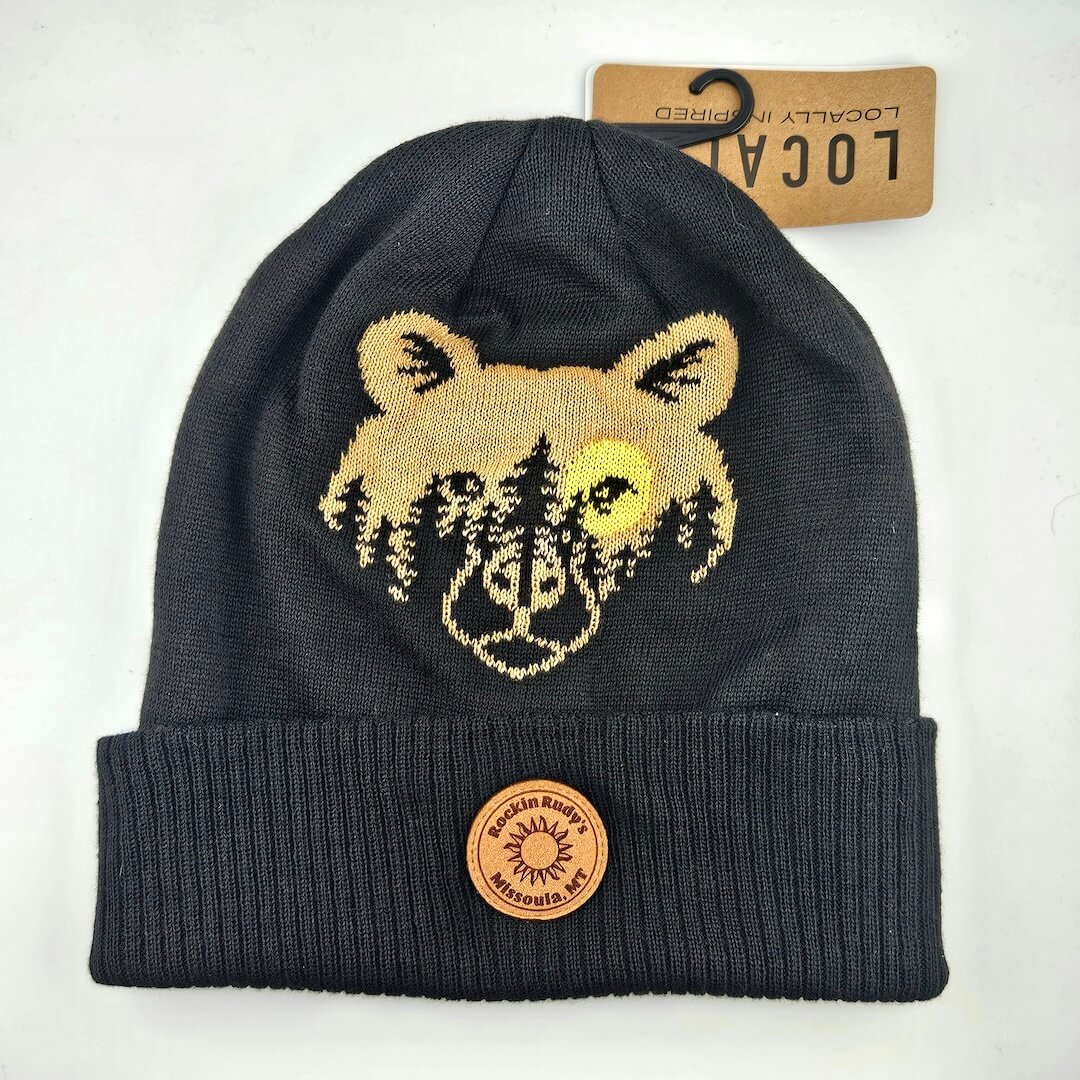 Black beanie with bear design and leather patch on a white background