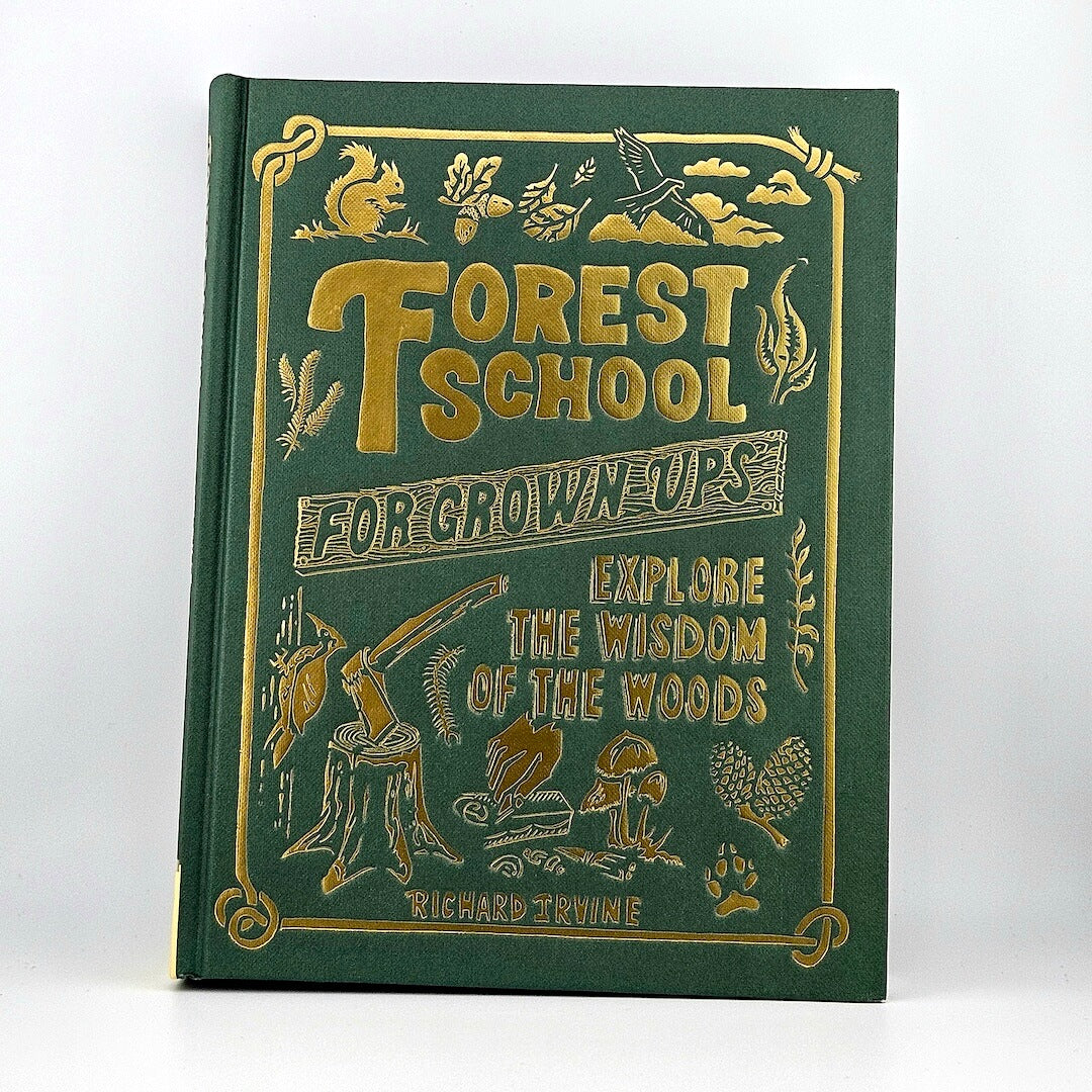 Book titled 'Forest School for Grown Ups' with gold text and illustrations on a green background