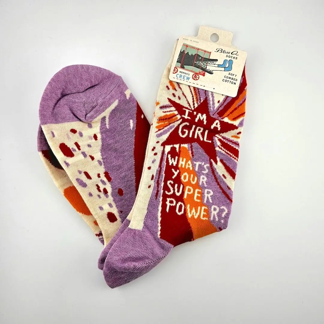 Colorful socks with text and patterns on a white background