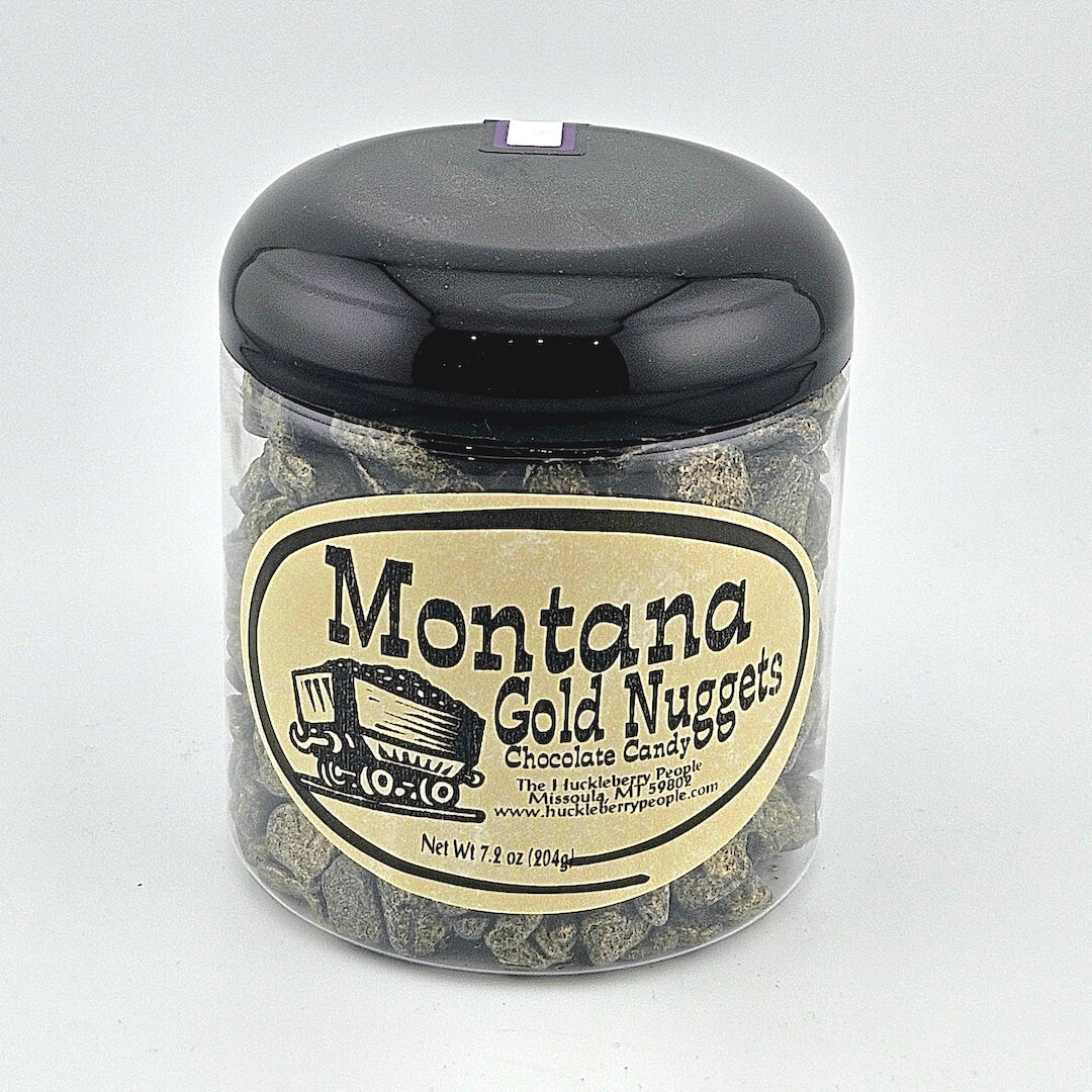 Jar of Montana Gold Nuggets chocolate candy with a black lid on a white background