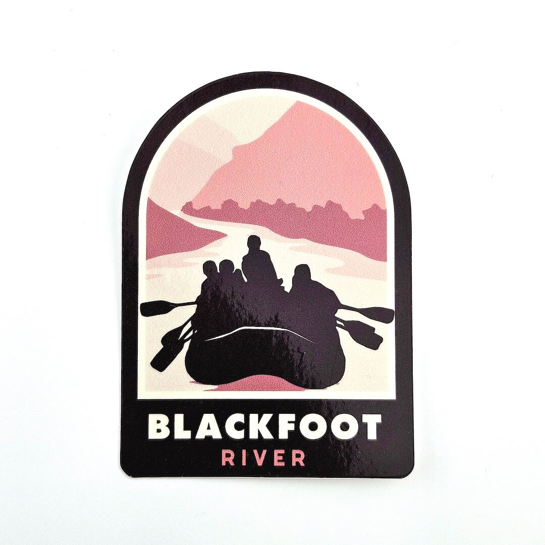 Sticker with silhouette of people in a raft and mountains, labeled 'Blackfoot River' on a white background.