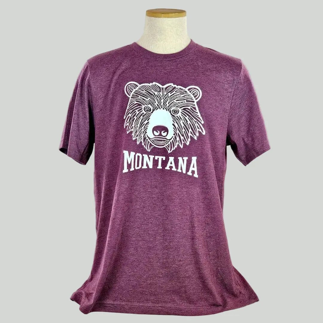 Maroon t-shirt with bear graphic and 'Montana' text on a mannequin against a plain background