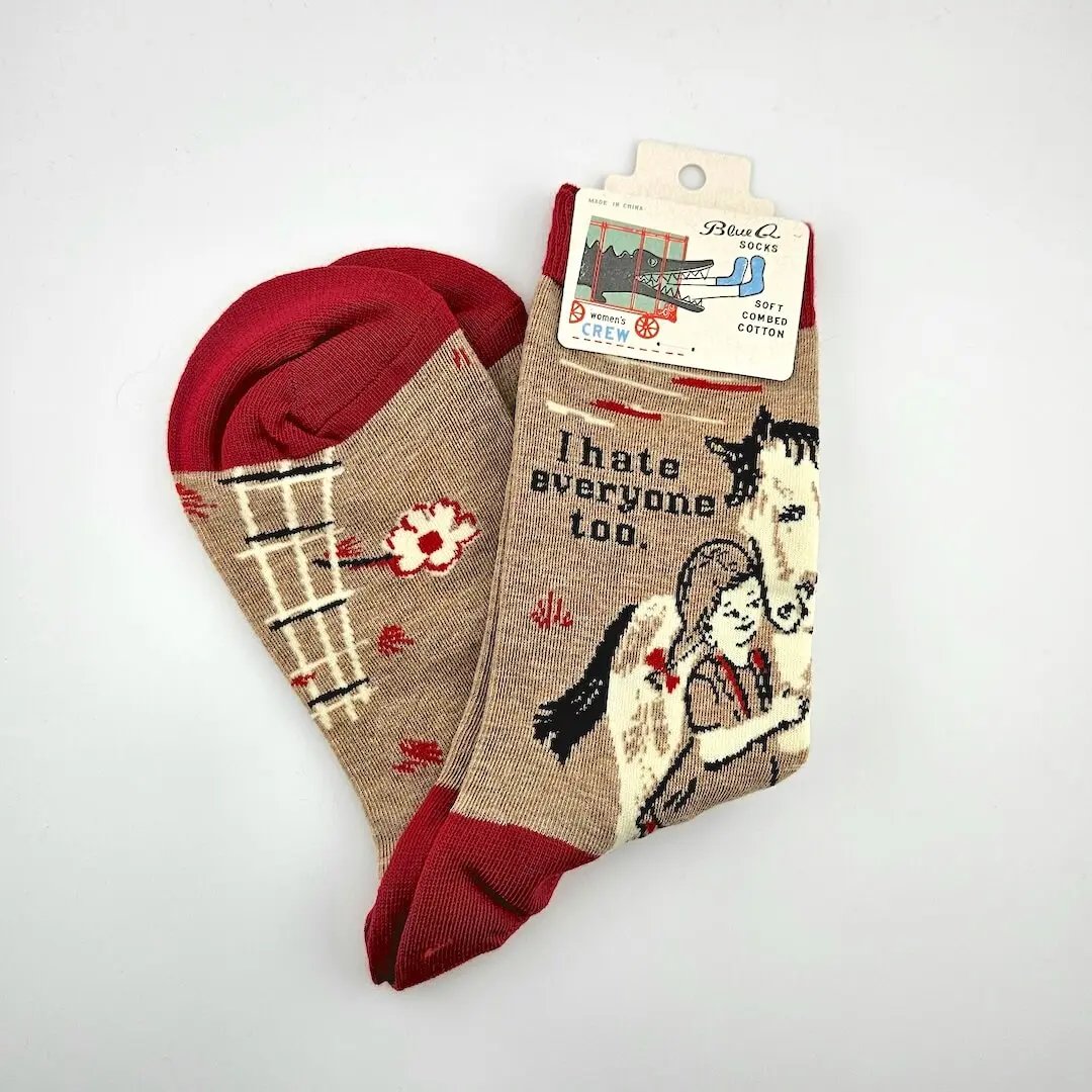 Pair of socks with a design and text on a white background
