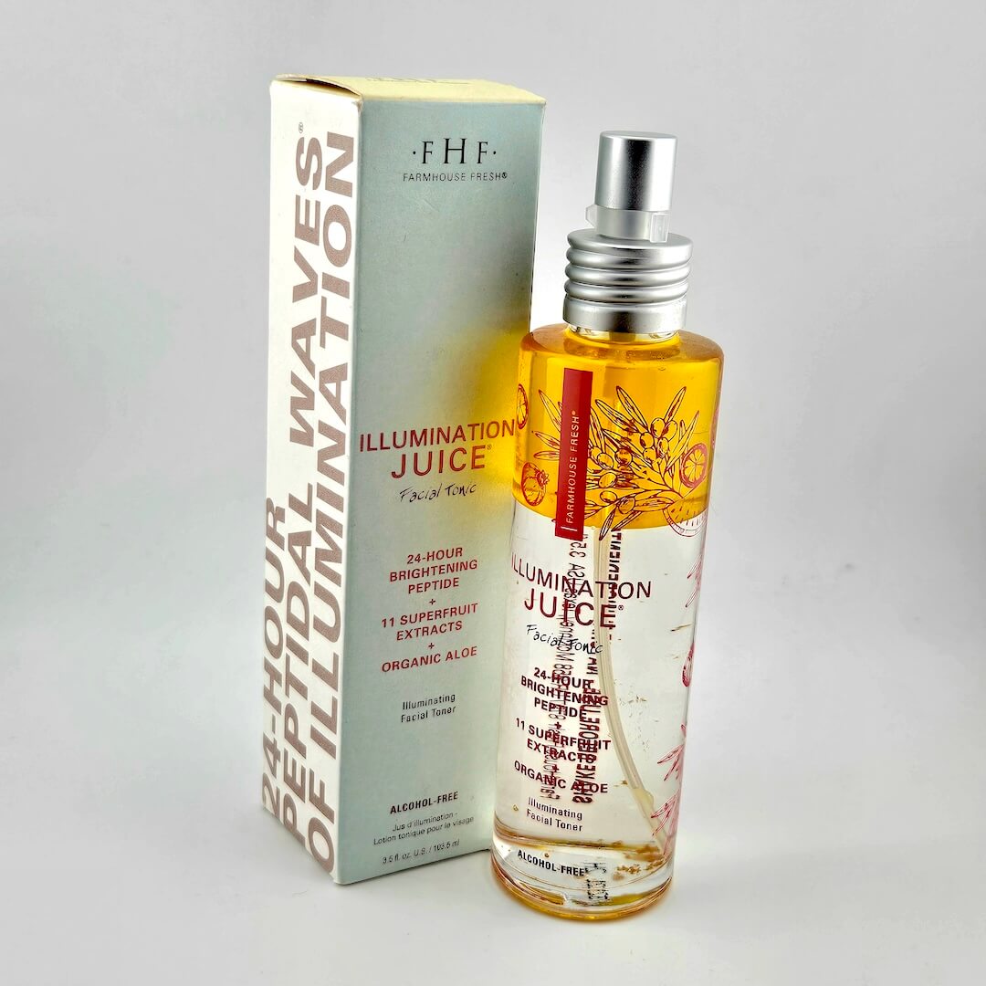 Bottle and box of 'FHF Illumination Juice' on a gray background