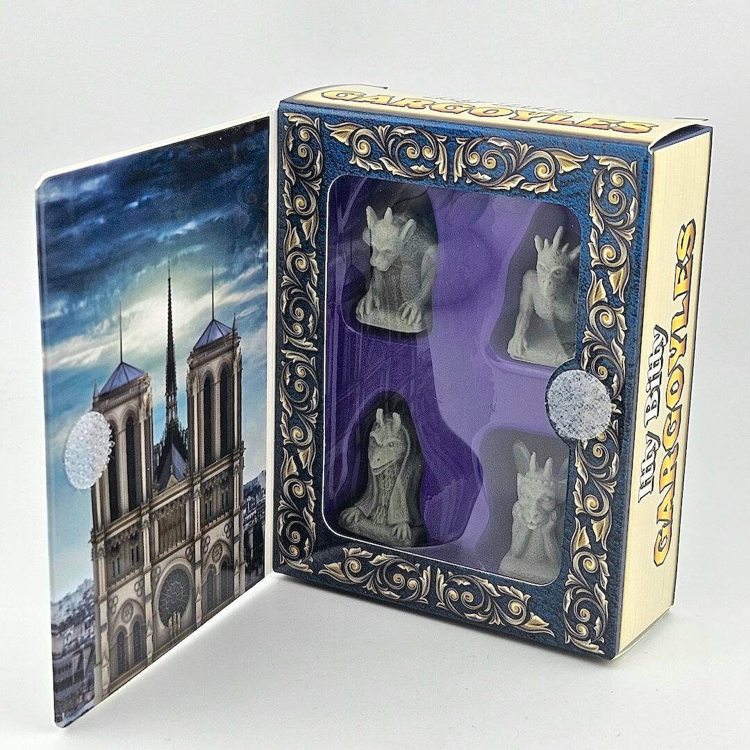View inside packaging for Itty Bitty Gargoyles against gray background.