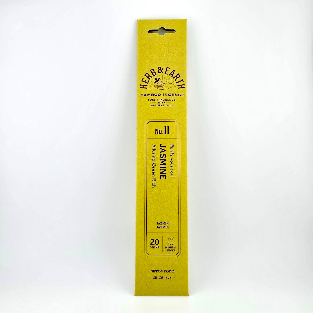 Yellow-green rectangular package of incense with brown text describing product.