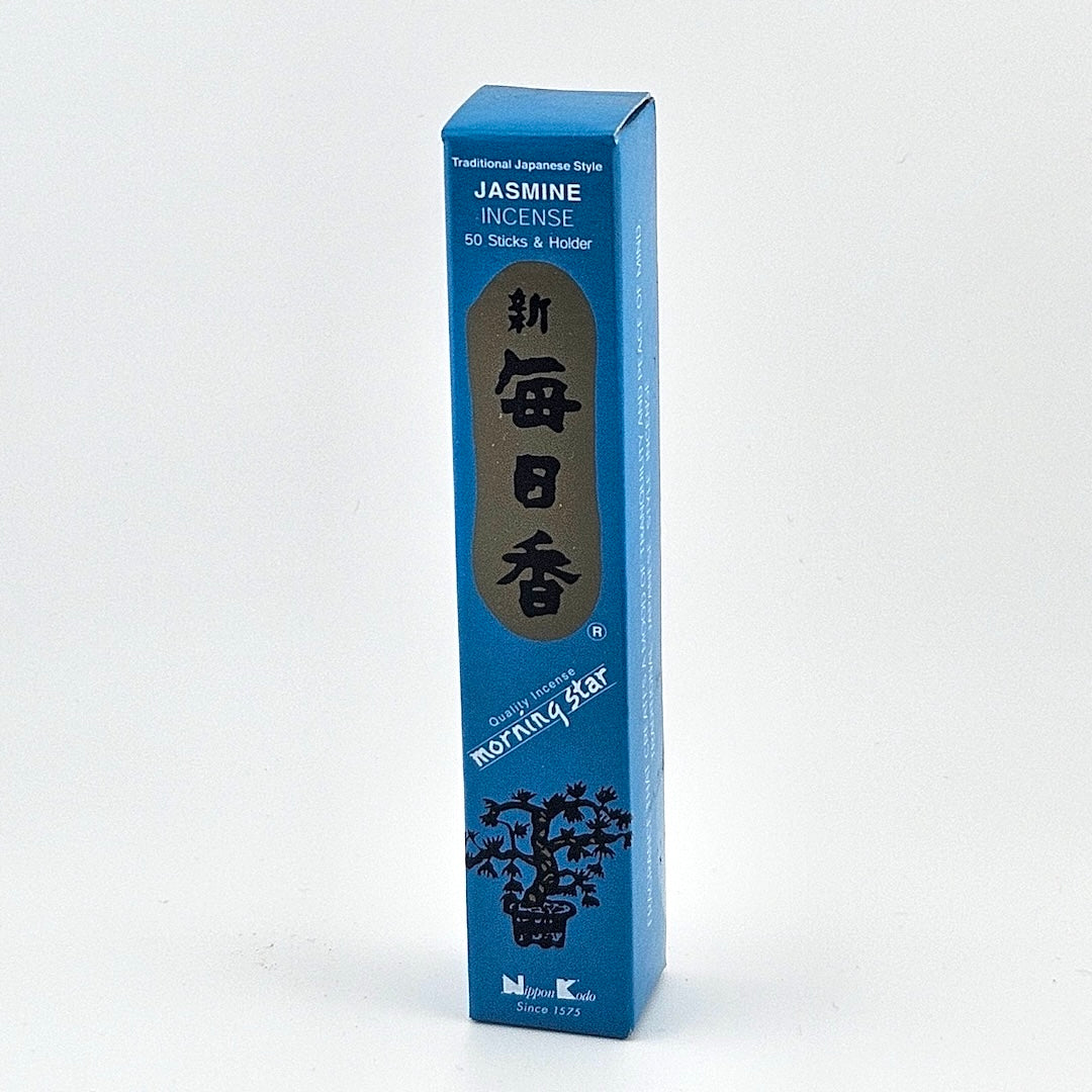 blue box of 50 incense sticks with Japanese writing above bonsai tree packaging on gray background.