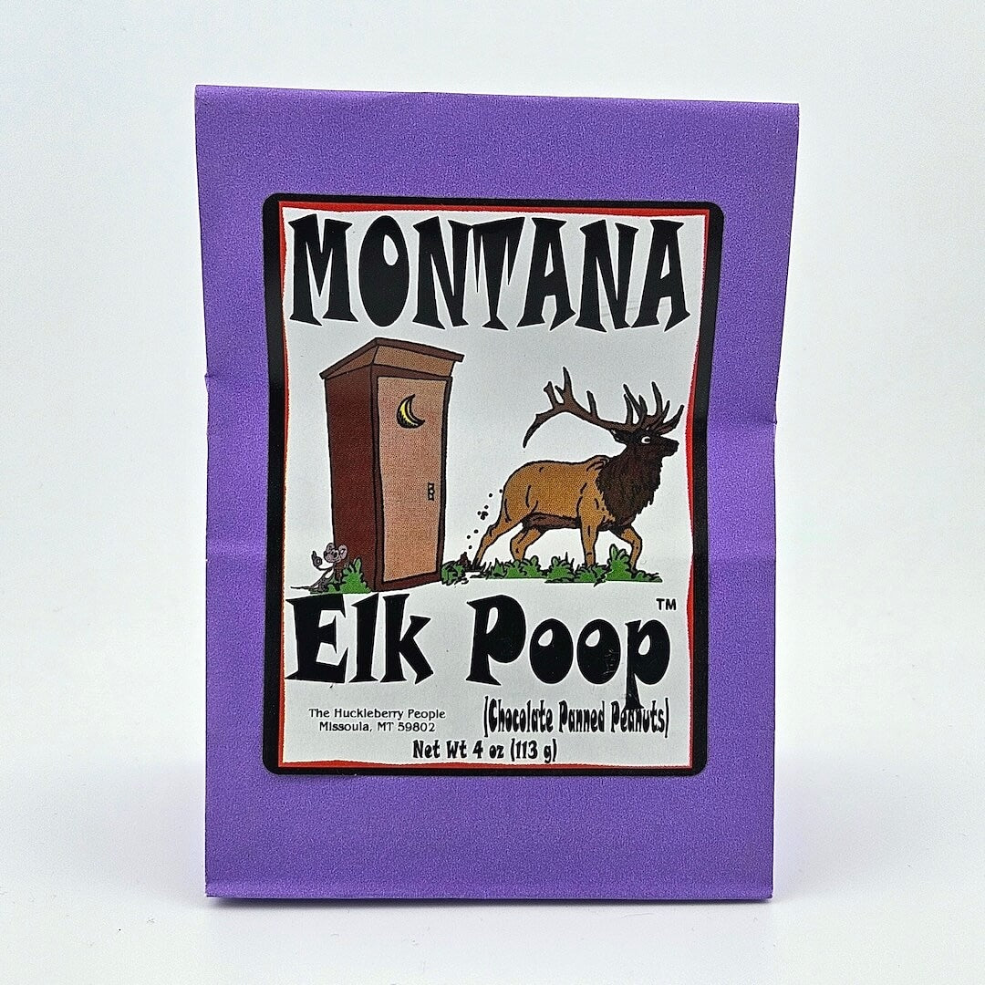 Purple paper bag; white label has image of elk outside outhouse framed by product information.