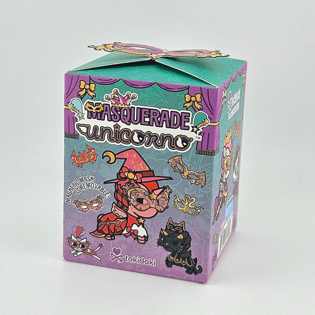 Brightly colored packaging for blind box unicorn figure against gray background.