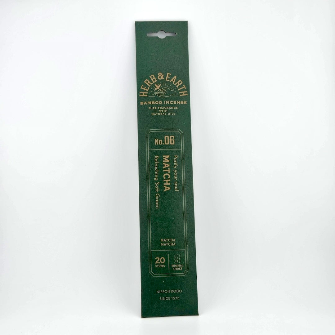 Dark green rectangular package of incense with brown text describing product.