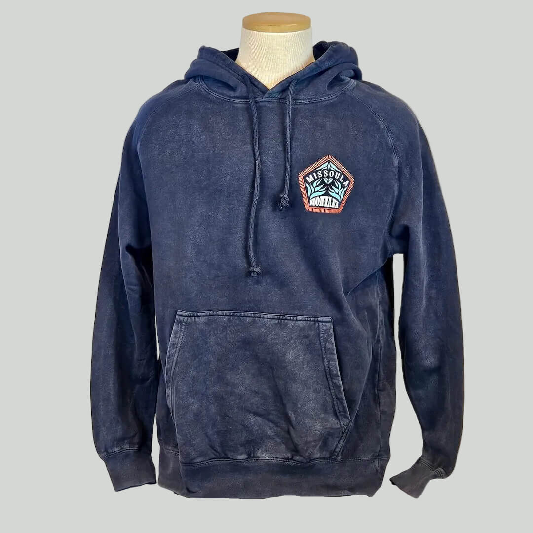 Blue hoodie with a patch on a mannequin against a white background