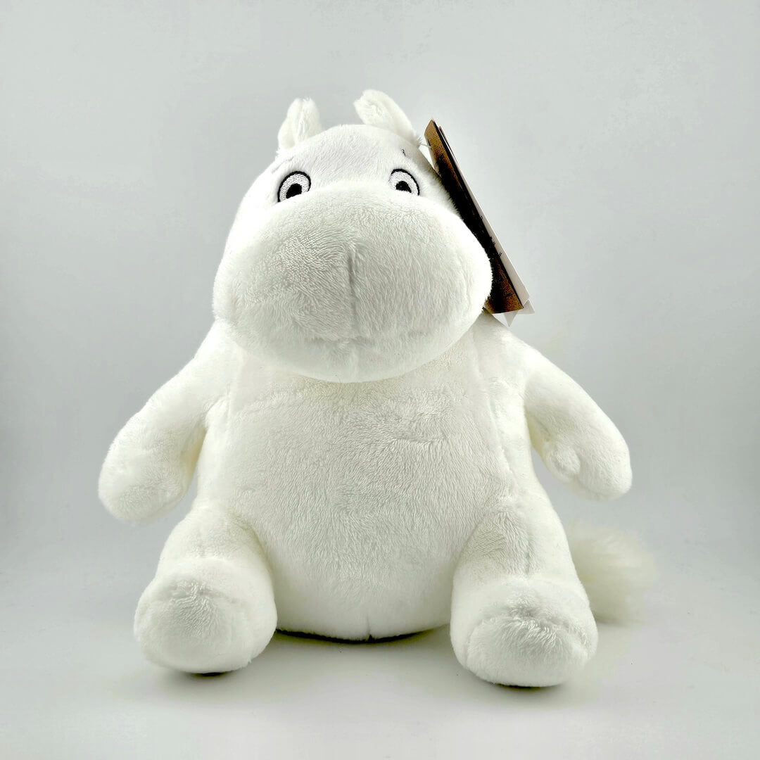 White horse-like plush animal against white background.