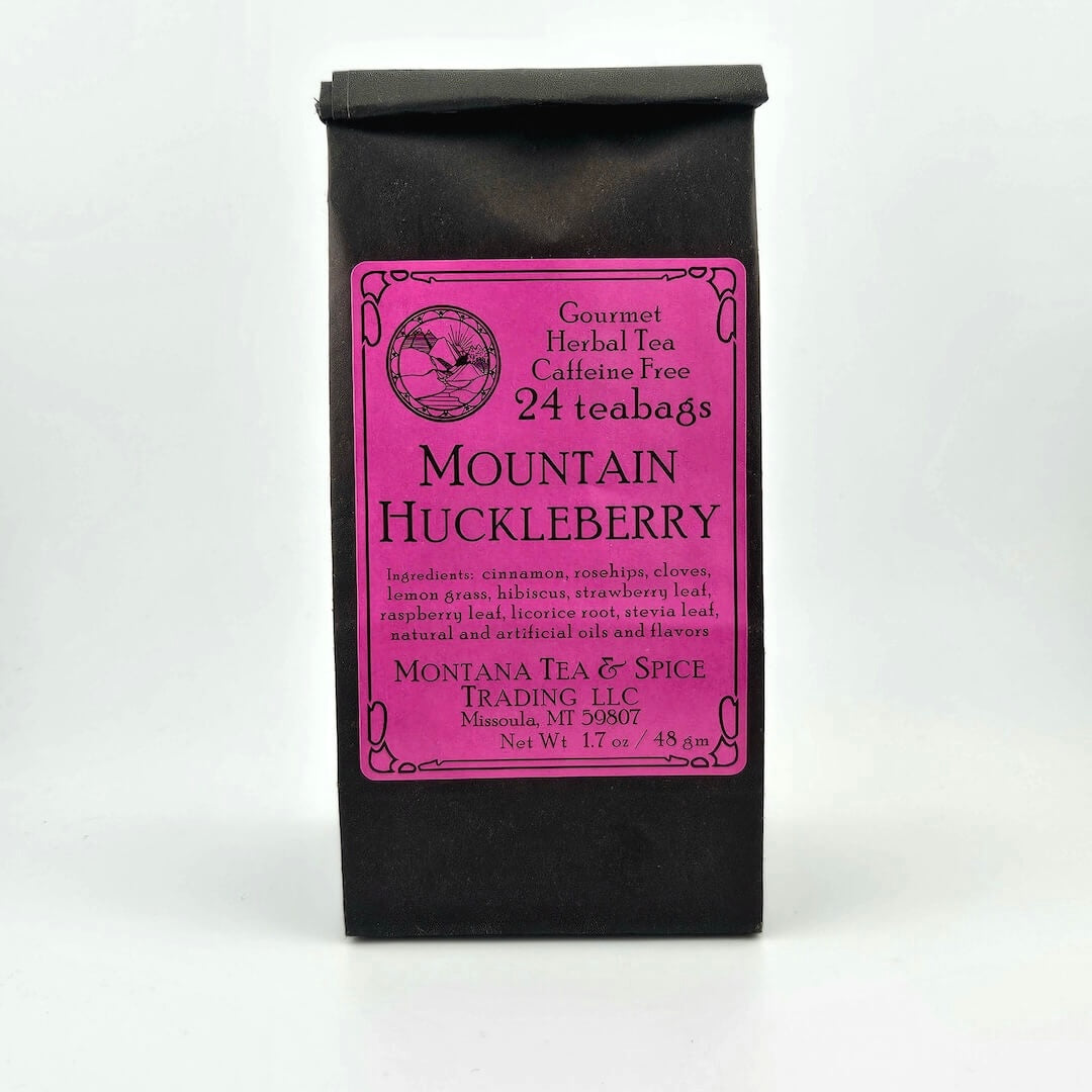 Black paper bag with rolled top with hot pink/fuchsia label describing flavor and ingredients.