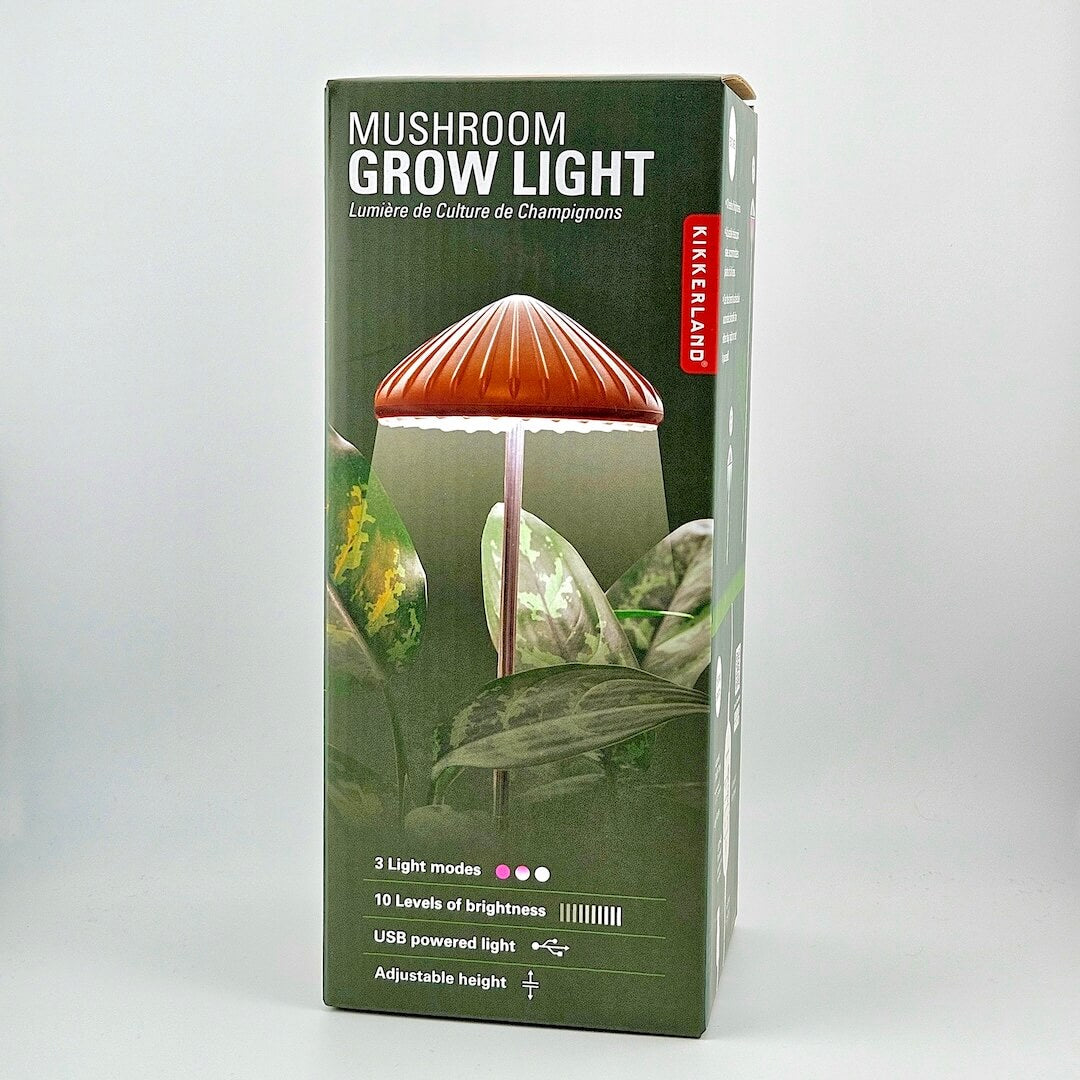 Box of a mushroom-shaped grow light with Kikkerland branding on a white background