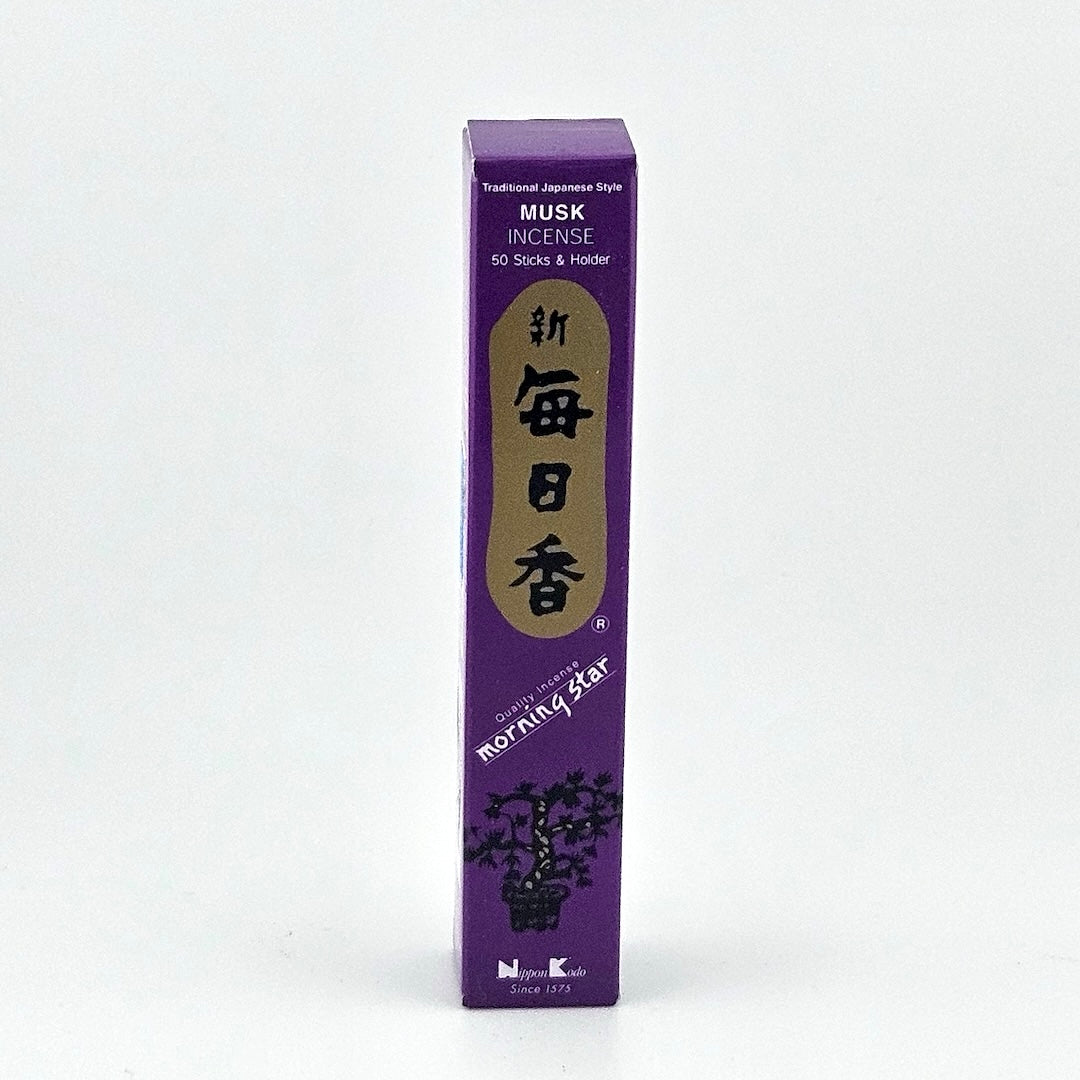 purple box of 50 incense sticks with Japanese writing above bonsai tree packaging on gray background.