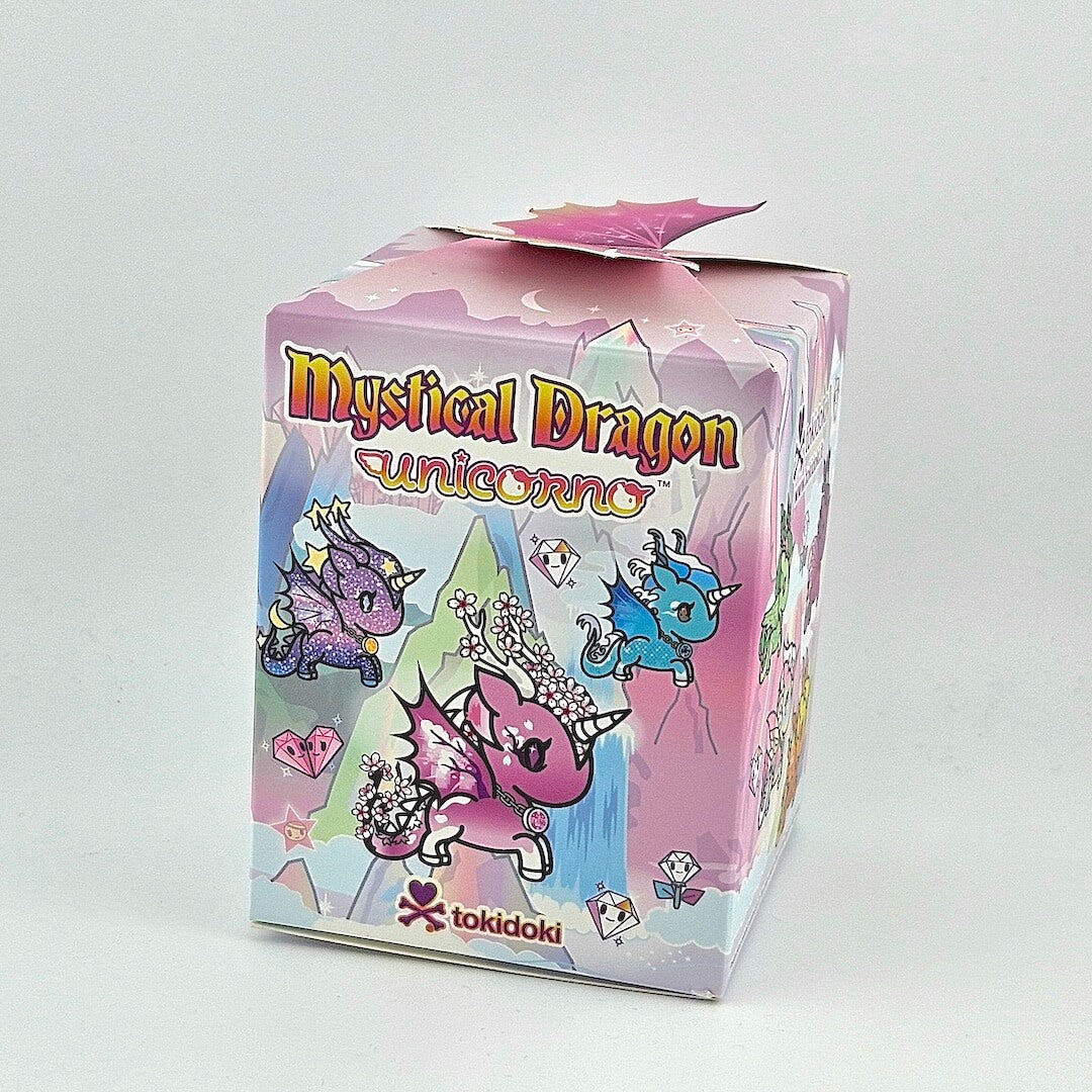 Brightly colored box with unicorn imagery against gray background.