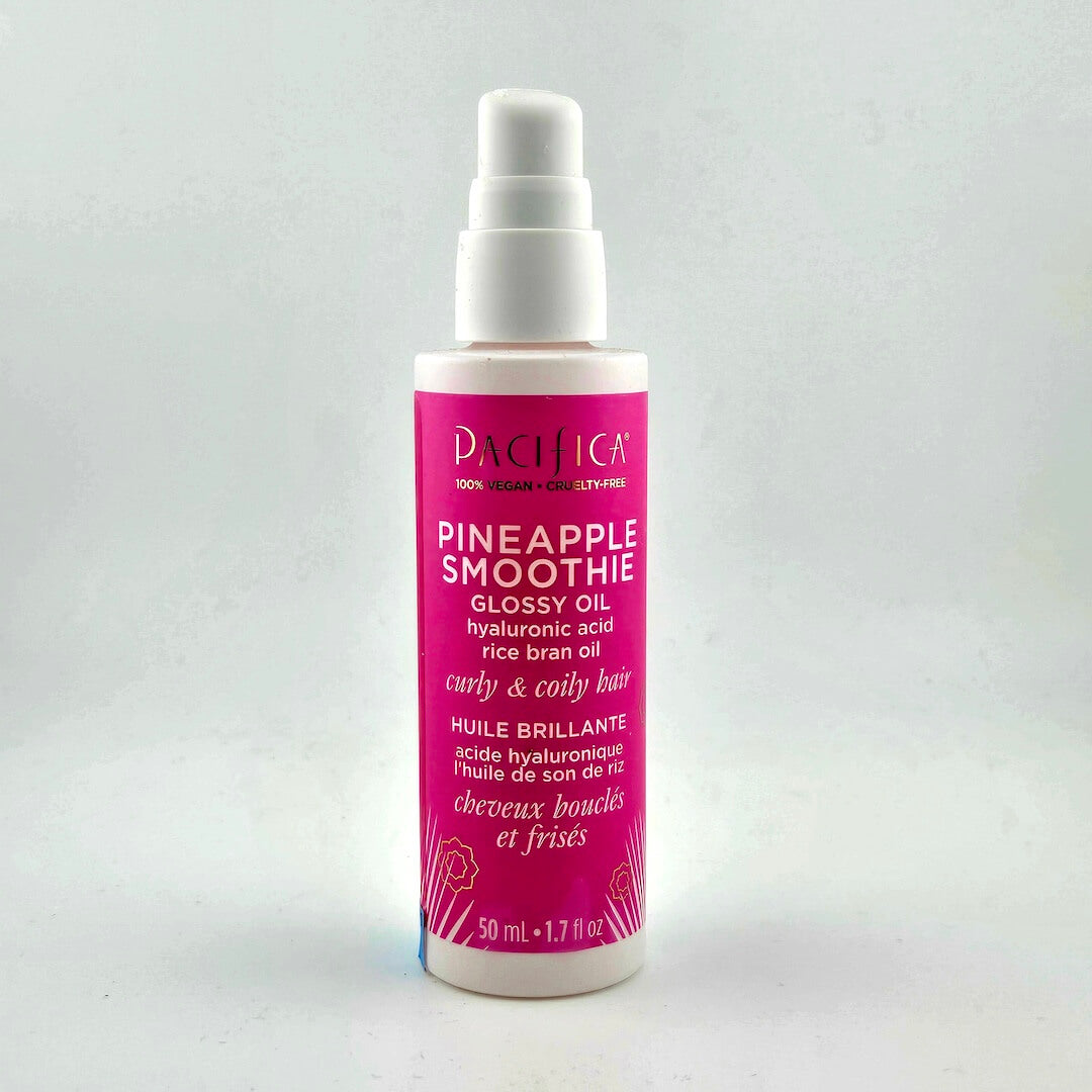 Pink bottle with white top and text against white background.