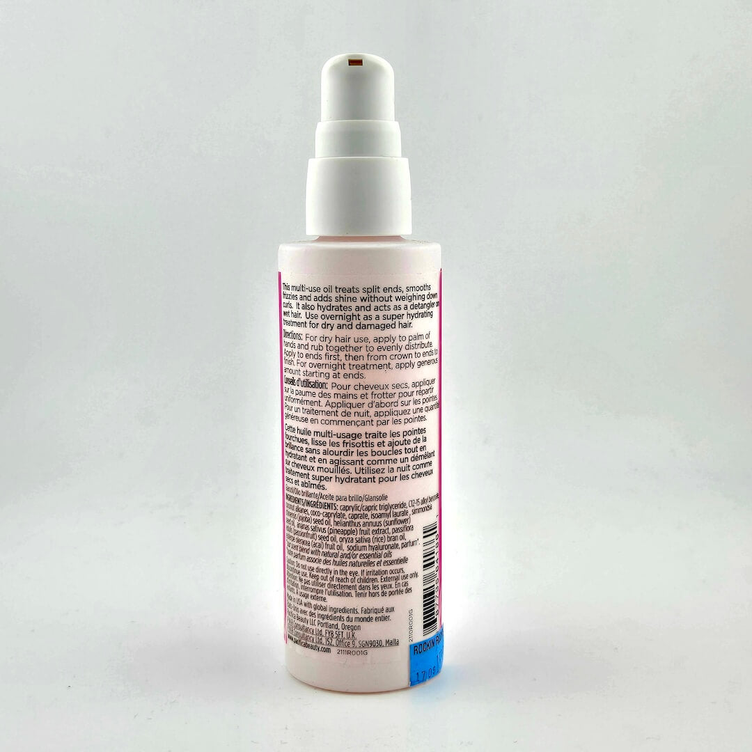 Backside of spray bottle with black text for instructions and ingredients against white background.