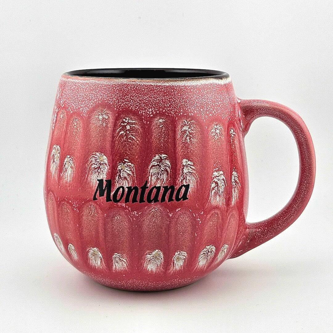 Red mug with 'Montana' text and horse design on a white background