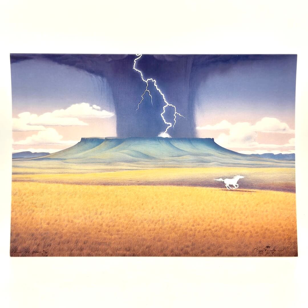 Greeting card of landscape with lightening striking a plateau in distance.