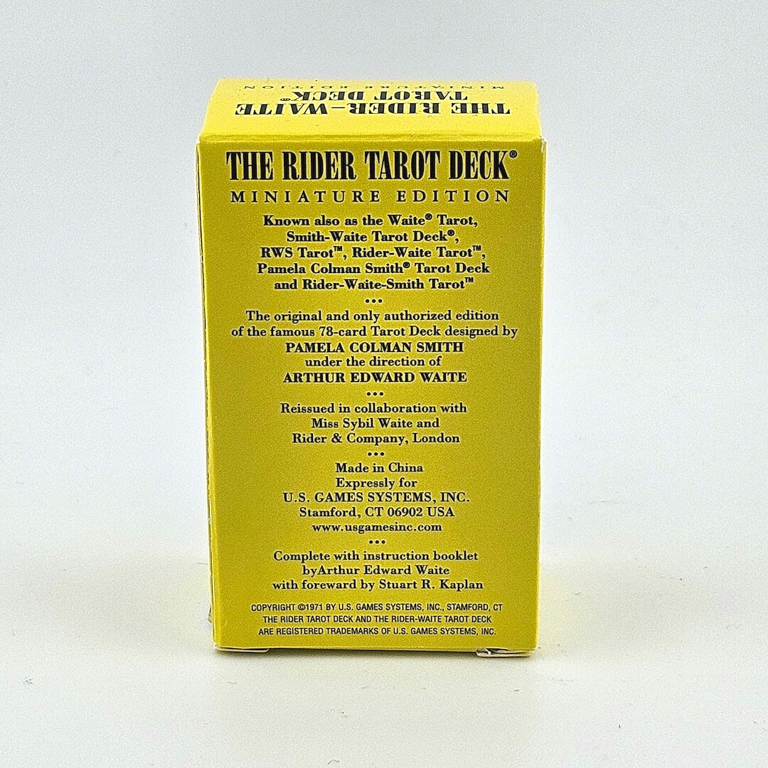 Back of yellow box with black text detailing artist and manufacturing information.