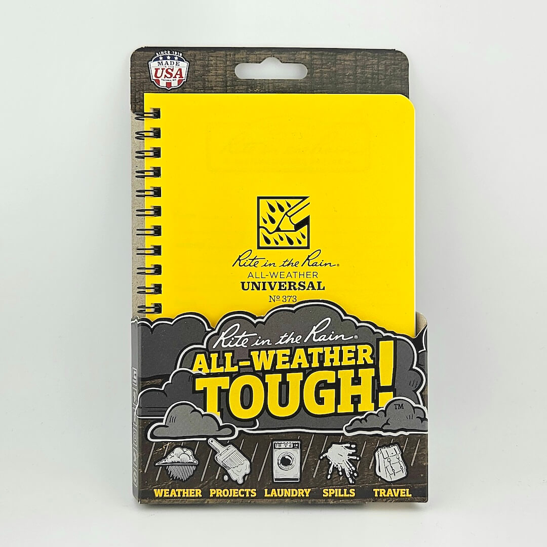 Notebook with yellow cover and black text on a white background