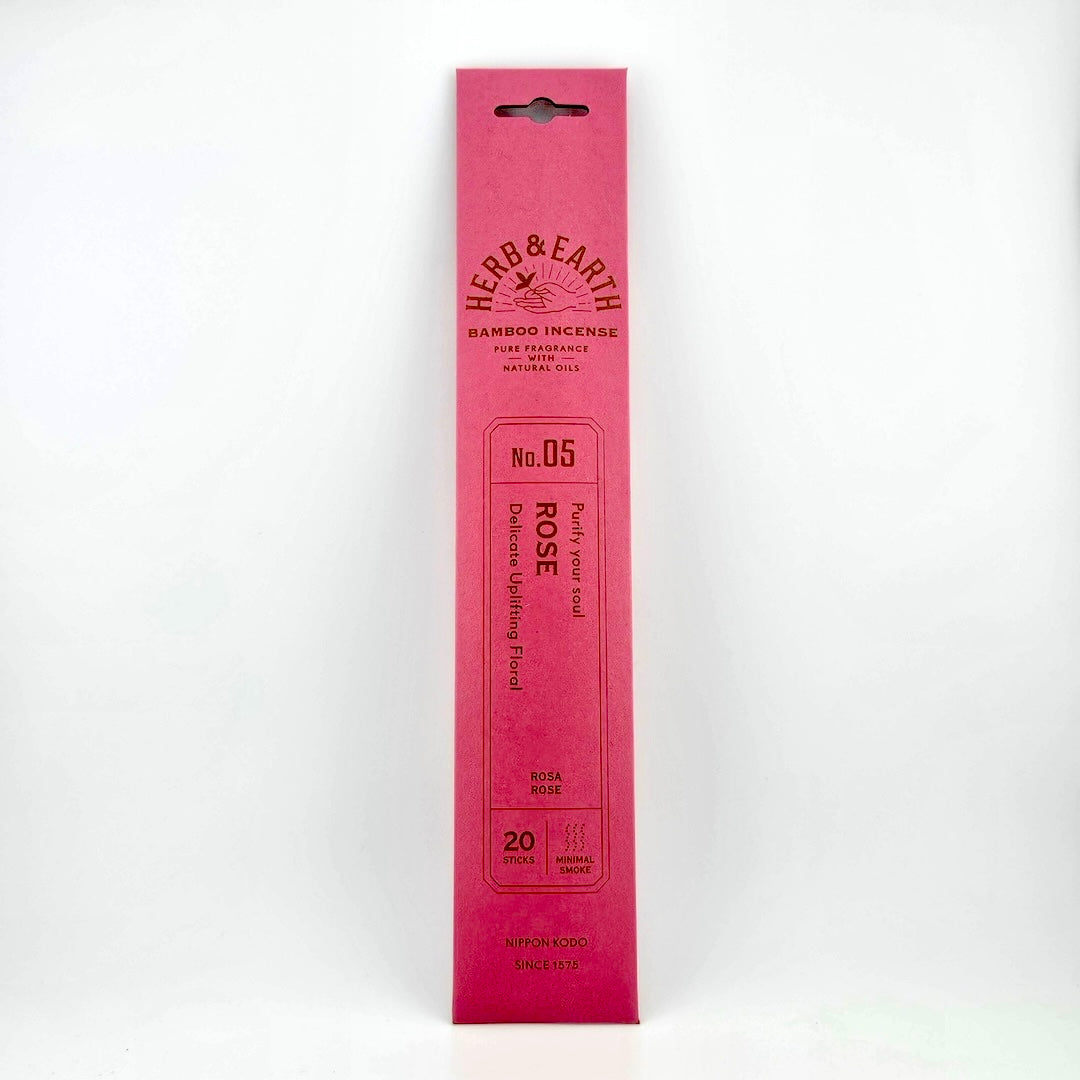 Rose pink rectangular package of incense with brown text describing product.