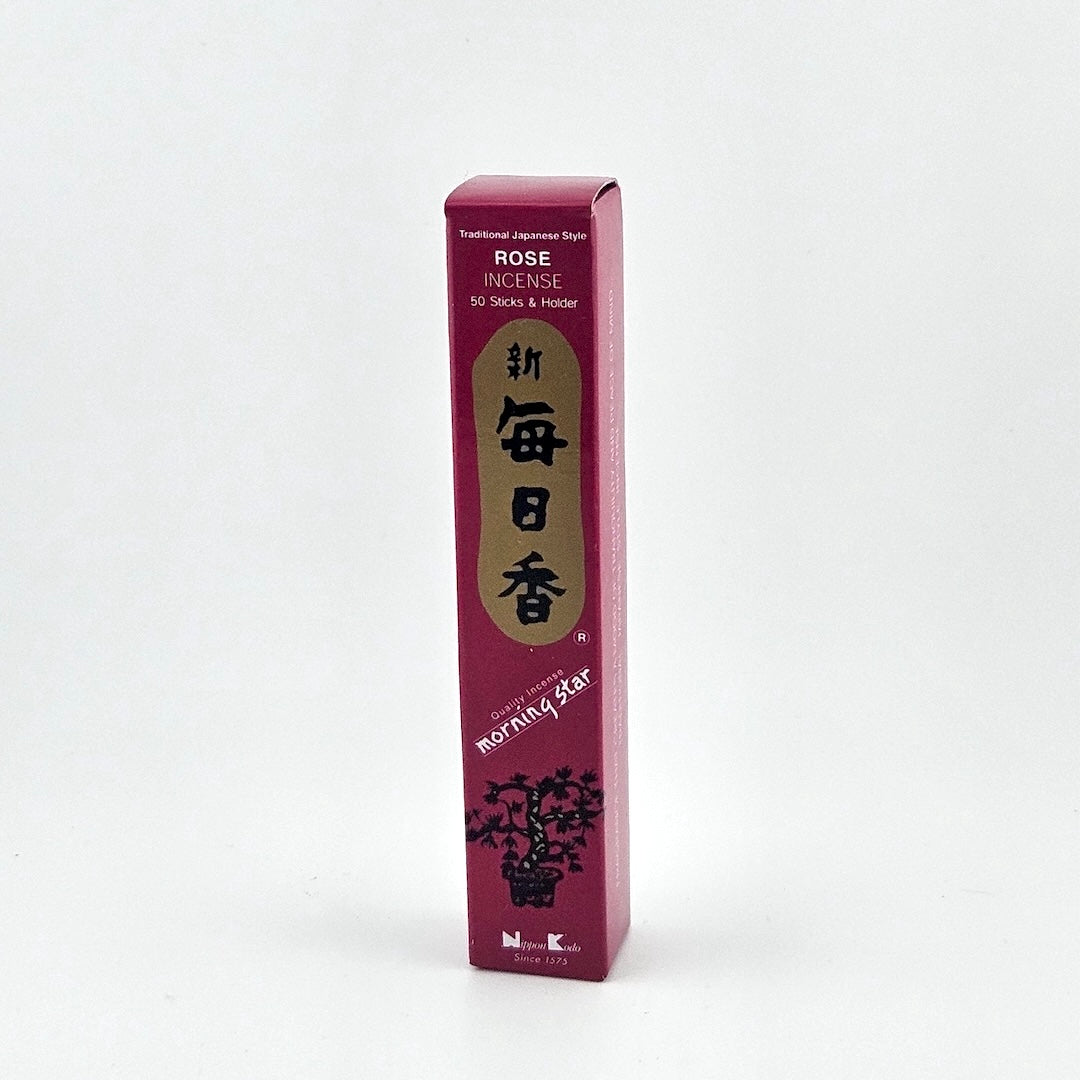 rose red box of 50 incense sticks with Japanese writing above bonsai tree packaging on gray background.