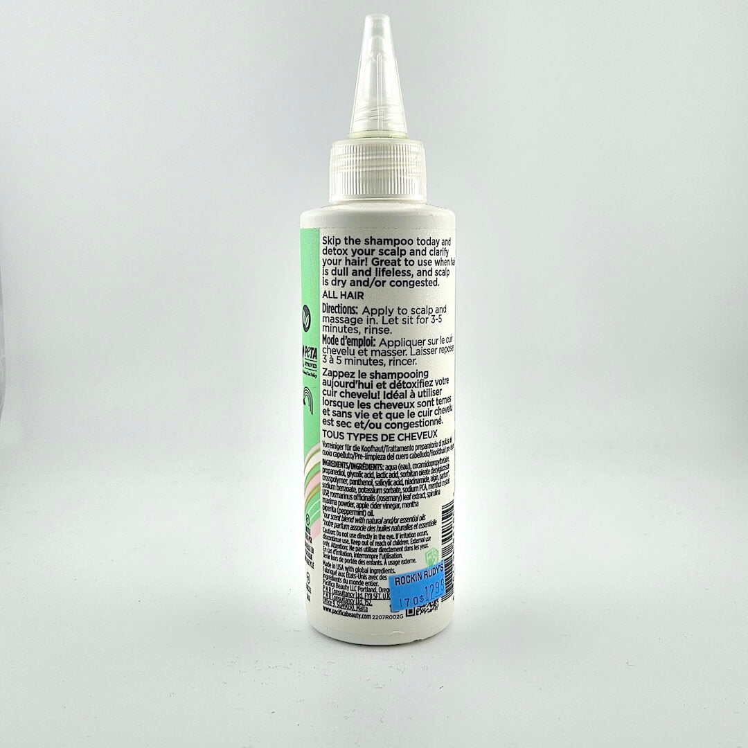 Backside of haircare bottle with product information in black text.