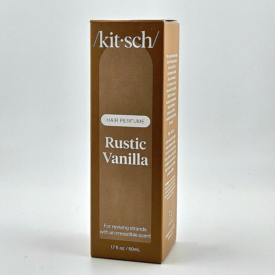 Brown box of 'kitsch' Rustic Vanilla hair perfume on a white background