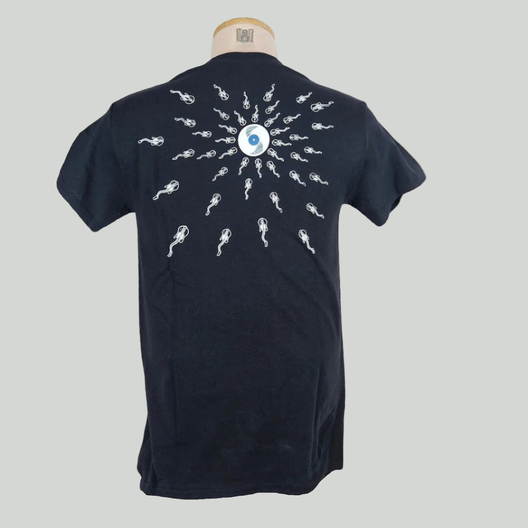 Black shirt with vinyl record off-center with wavy neck guitars radiating from it. Design stretches across back.