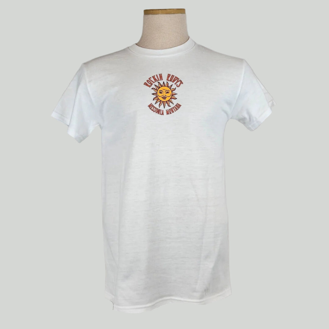 White colored t-shirt with small sun in center with "ROCKIN RUDY'S" & "MISSOULA, MONTANA" encircling it.