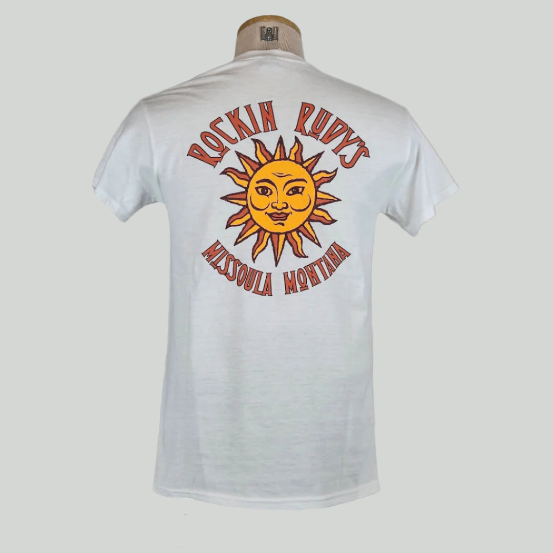 White colored t-shirt with large sun in center with "ROCKIN RUDY'S" & "MISSOULA, MONTANA" encircling it.
